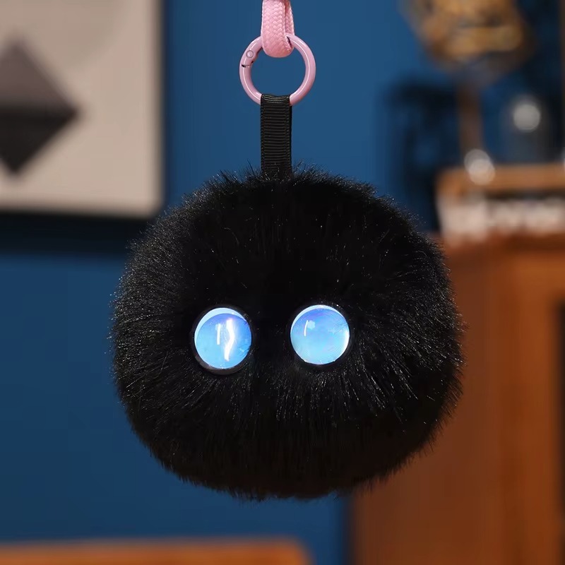 Primer plano del PunchiBot negro con ojos azules
